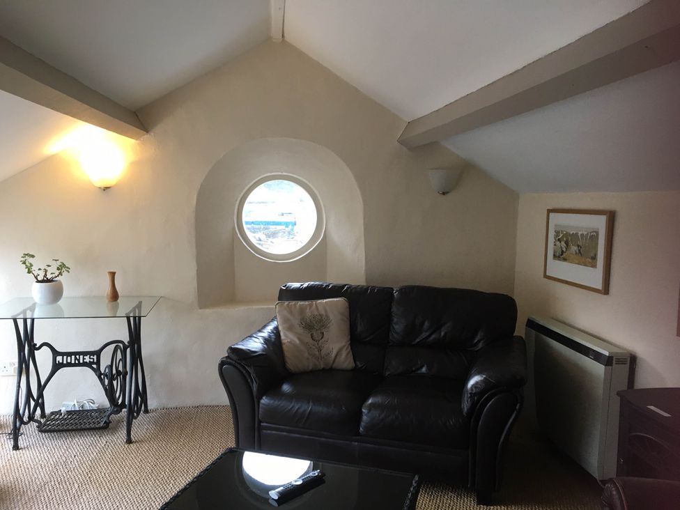 A living room with a sofa and a table at Cottage - Sleeps 4 - Pets Ok - Garden - Parking in Carnforth