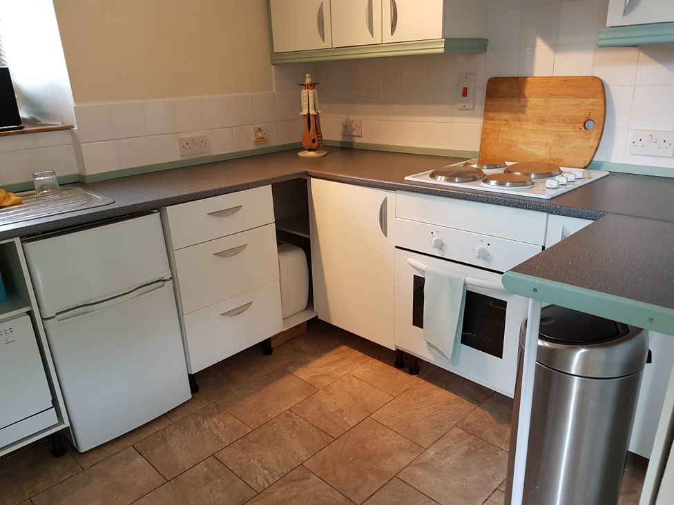 A kitchen with appliances and storage at Cottage - Sleeps 4 - Pets Ok - Garden - Parking, Carnforth