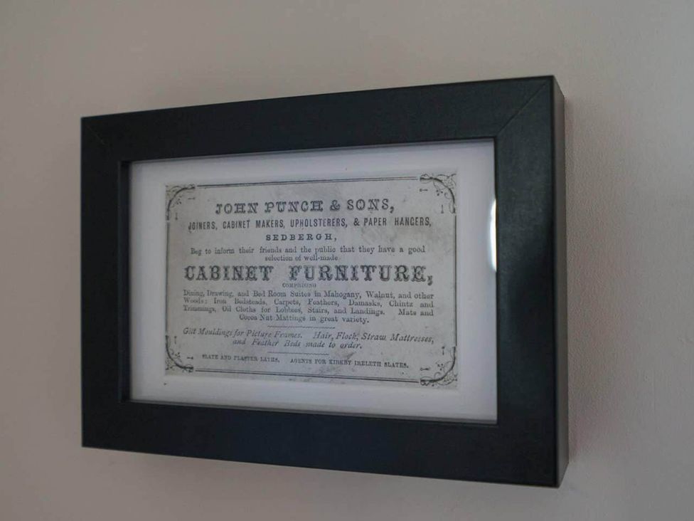 A framed document on a wall at Sedbergh Penthouse - KingBed - Tv - Wifi, Sedbergh