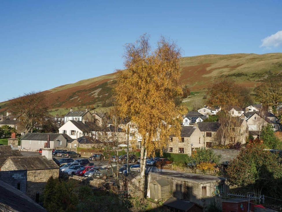 A village scene with trees and buildings at Sedbergh Penthouse - KingBed - Tv - Wifi in Sedbergh