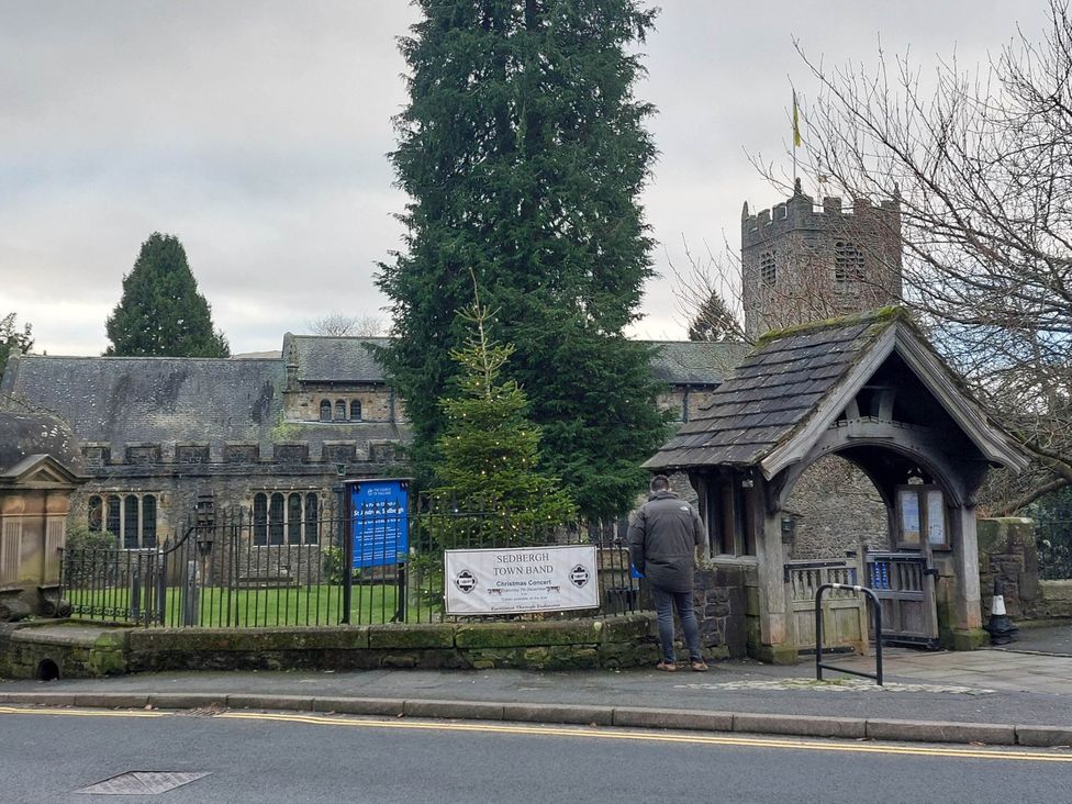 An outdoor view of a church and entrance in Sedbergh