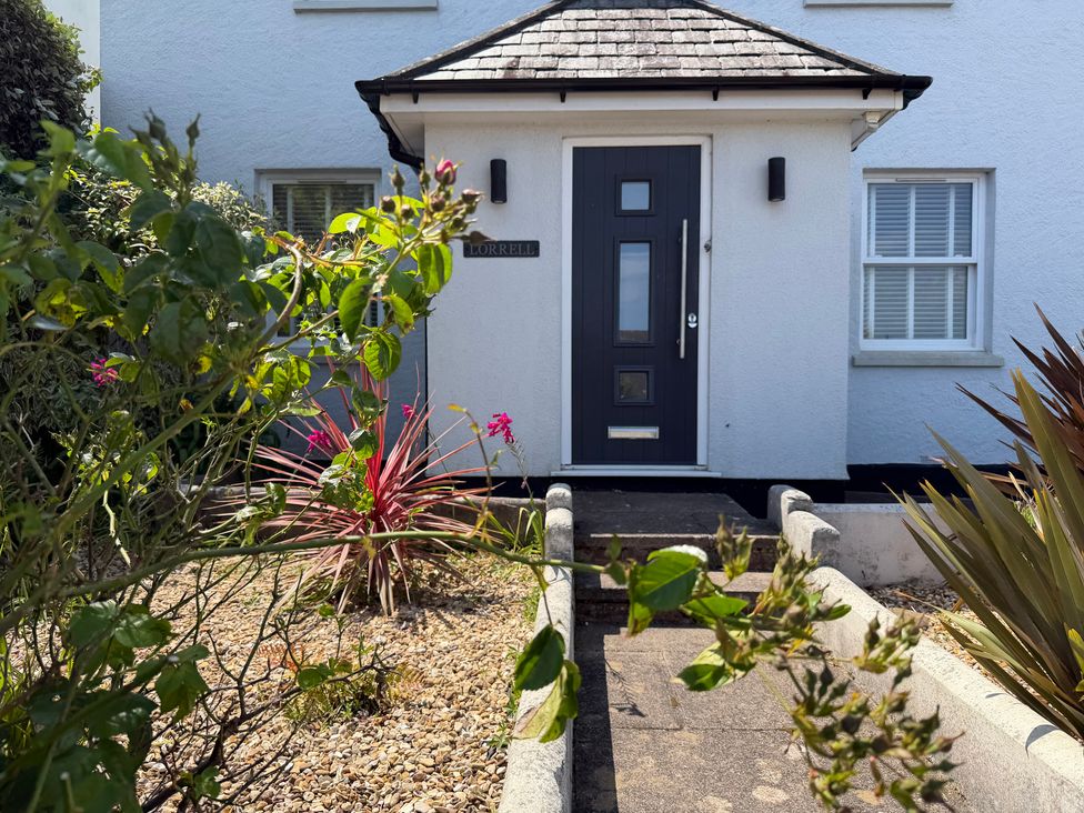 An entrance with a door and plants at Lorrell in Salcombe