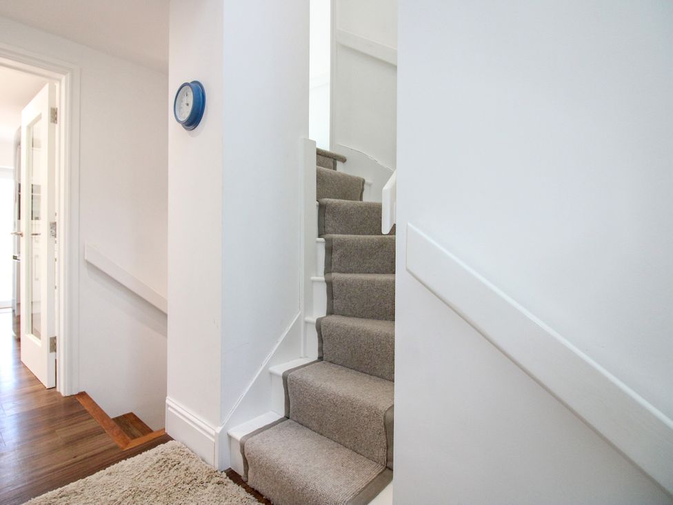 A staircase in a hallway at Lorrell in Salcombe