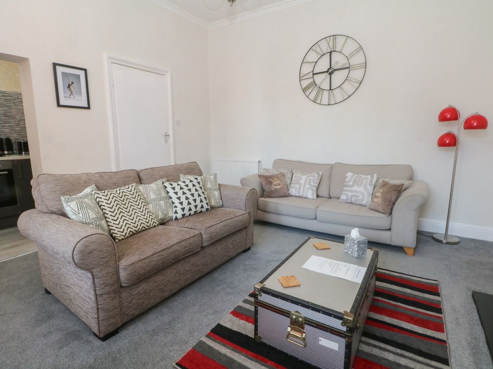 A living room with two sofas and a coffee table at Apartment 2 in Lytham St. Annes