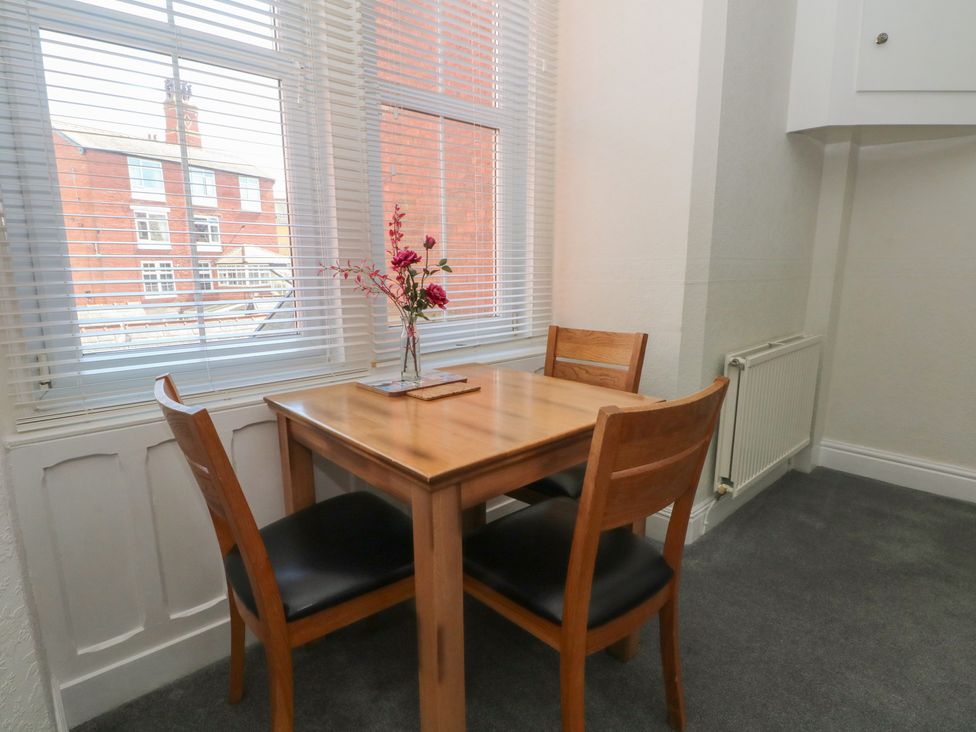 A dining room with a table and chairs at Apartment 2 in Lytham St. Annes