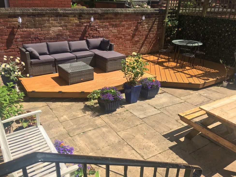 A garden area with seating and plants at Apartment 2 in Lytham St. Annes