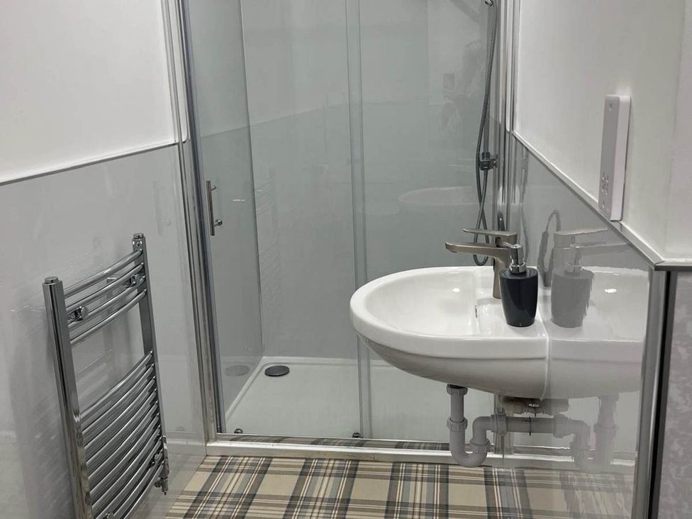 A bathroom with a shower and sink at Buckie Haven 3 Bed Contractors Business Travellers in Buckie