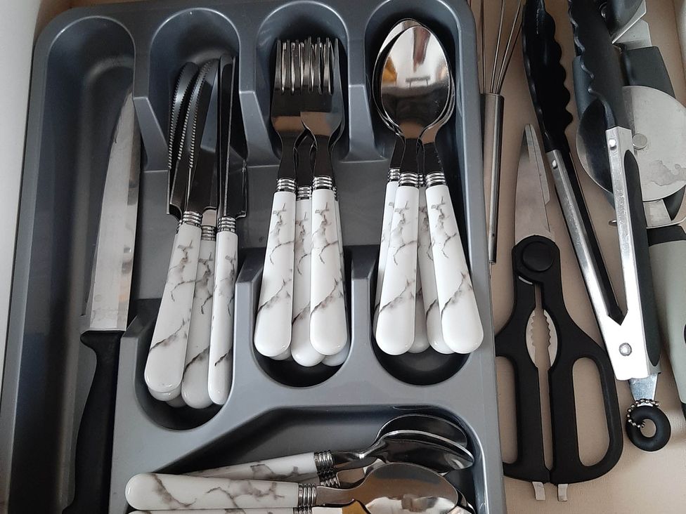 A kitchen cutlery tray with utensils at Taid's Retreat Silversands Cove beach lossiemouth