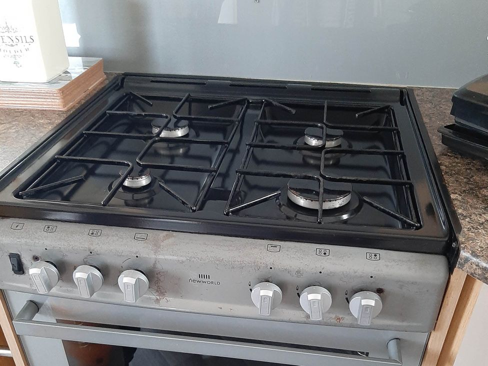 A gas hob with burners and control knobs at Taid's Retreat Silversands Cove beach lossiemouth