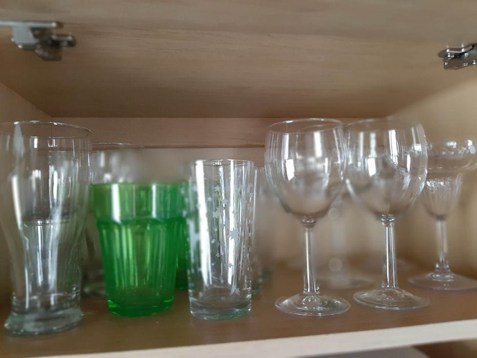 A collection of glassware including tumblers and wine glasses at Taid's Retreat Silversands Cove beach lossiemouth