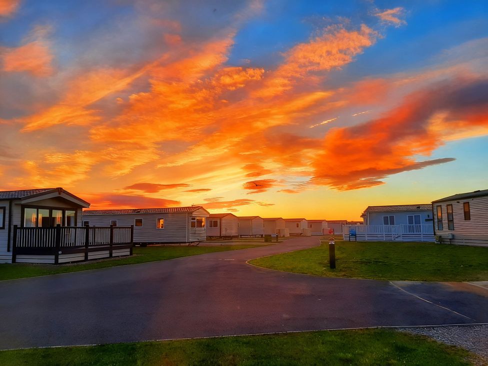 A pathway with caravans at Taid's Retreat Silversands Cove beach lossiemouth