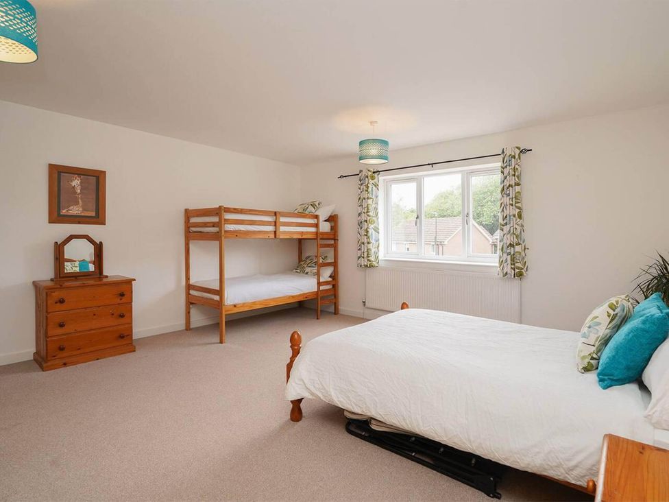 A bedroom with a bunk bed and a double bed at Rent My Spa Home with Pool table, Hottub and Sauna in Chesterfield