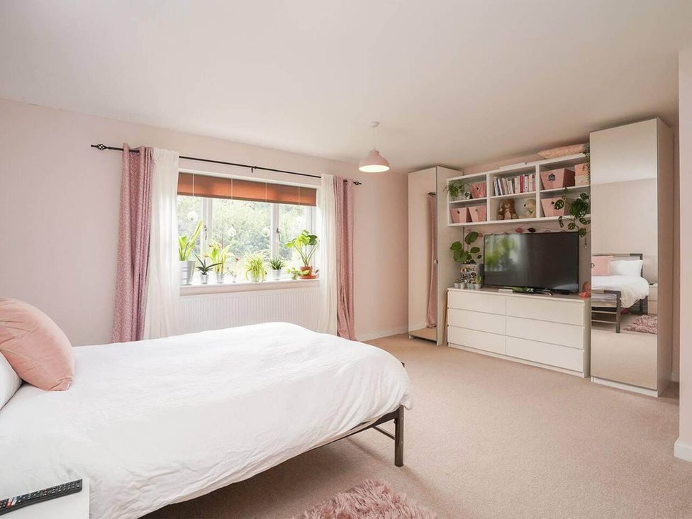 A bedroom with a bed and television at Rent My Spa Home with Pool table, Hottub and Sauna, Chesterfield