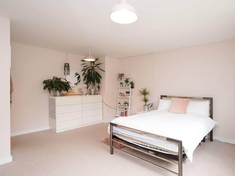 A bedroom featuring a bed and a dresser at Rent My Spa Home with Pool table, Hottub and Sauna, Chesterfield