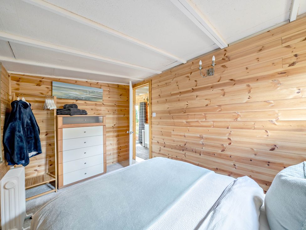 A bedroom with a bed and a drawer unit at Peaceful Cabin in Skegby -Sleeps2- Fire Pit, Stanton Hill