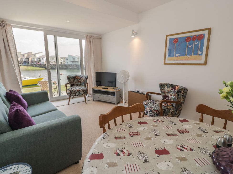 A living room with furniture and a view at Harbourside in Porthmadog