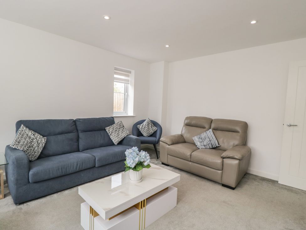 A living room with sofas and a coffee table at 1 Brunel Court