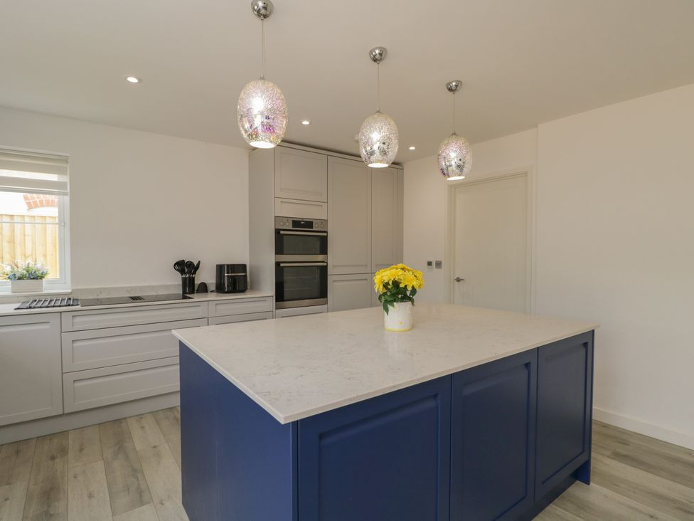 A kitchen with a center island and appliances at 1 Brunel Court in 