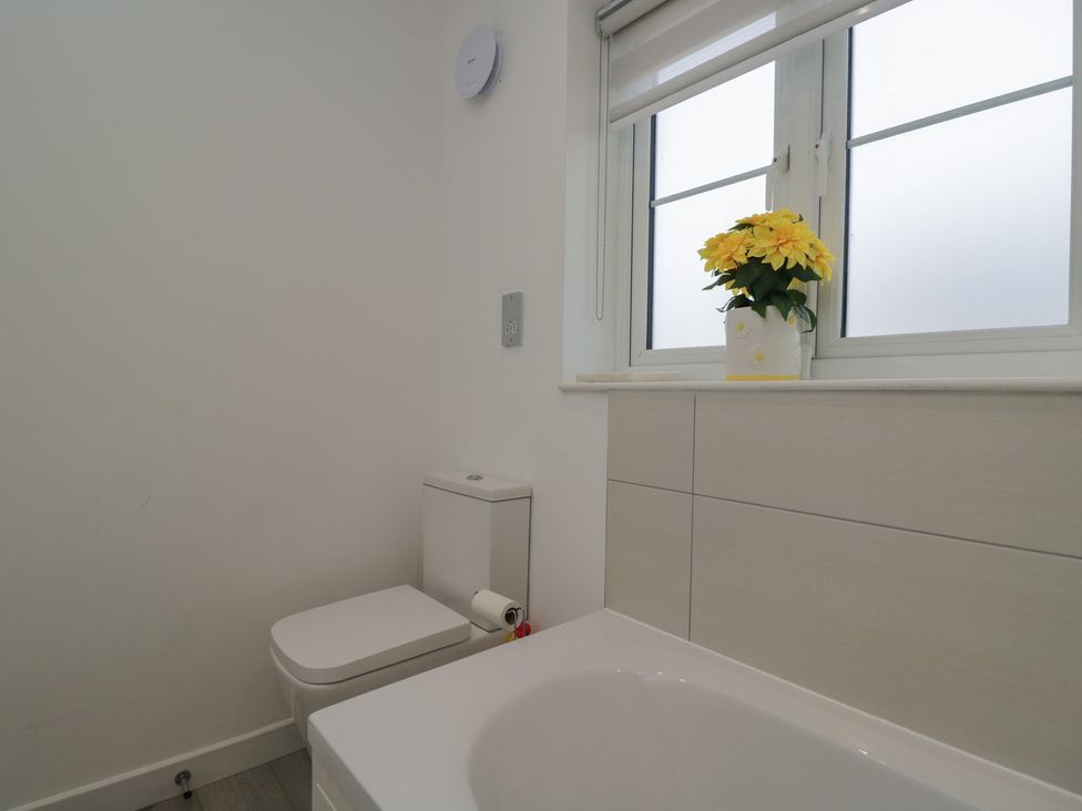A bathroom with a toilet and a sink at 1 Brunel Court