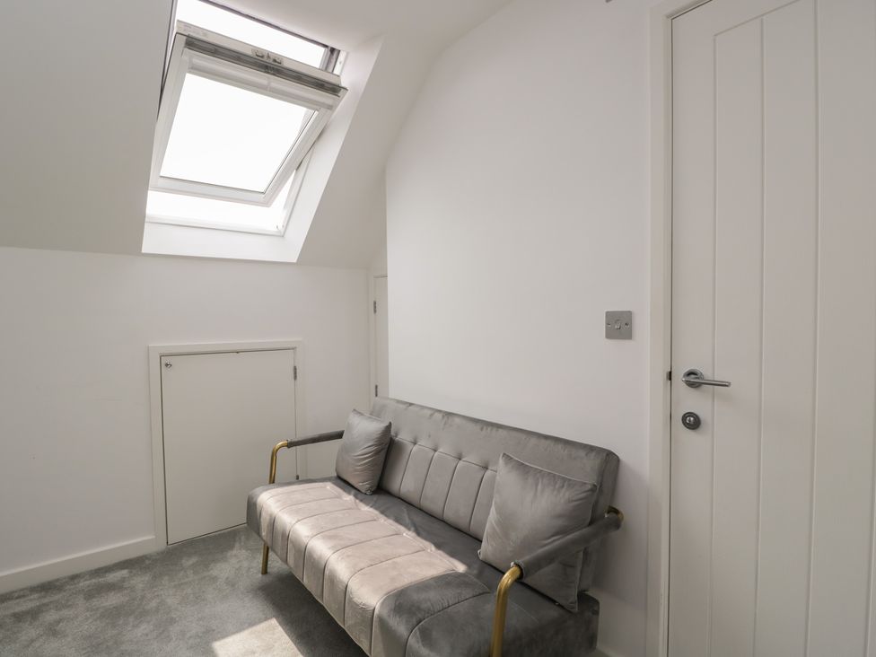 A snug with a sofa and skylight at 1 Brunel Court