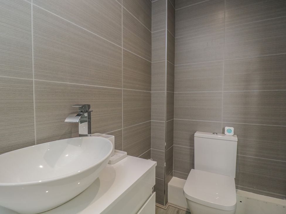 A bathroom with a sink and toilet at 1 Brunel Court