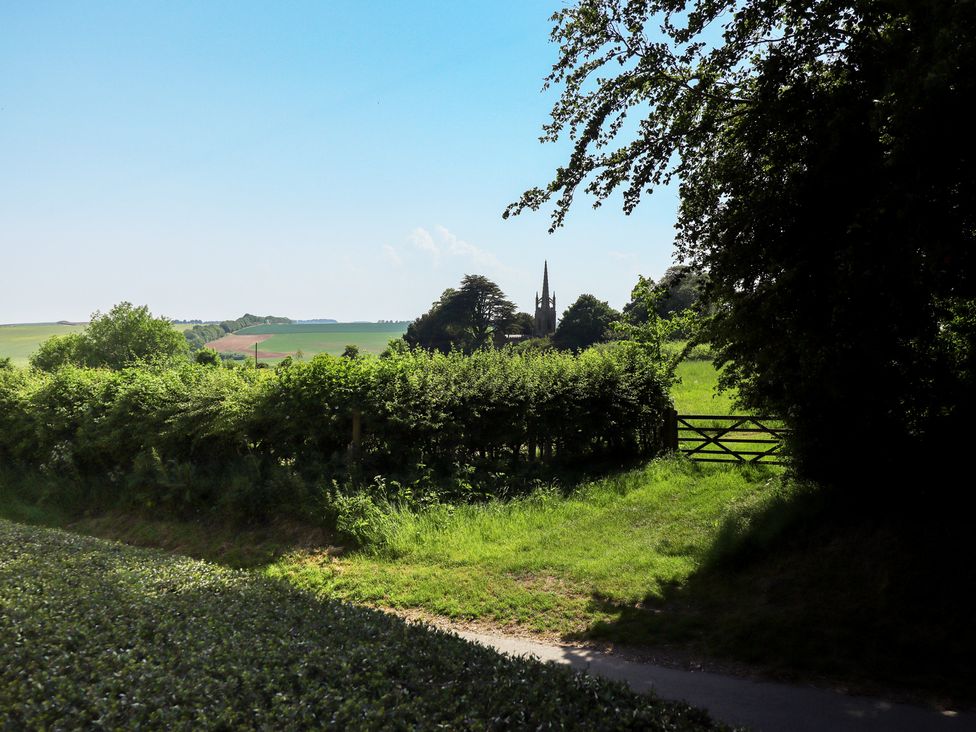 A view of green fields and a church spire at Ivy House near Louth