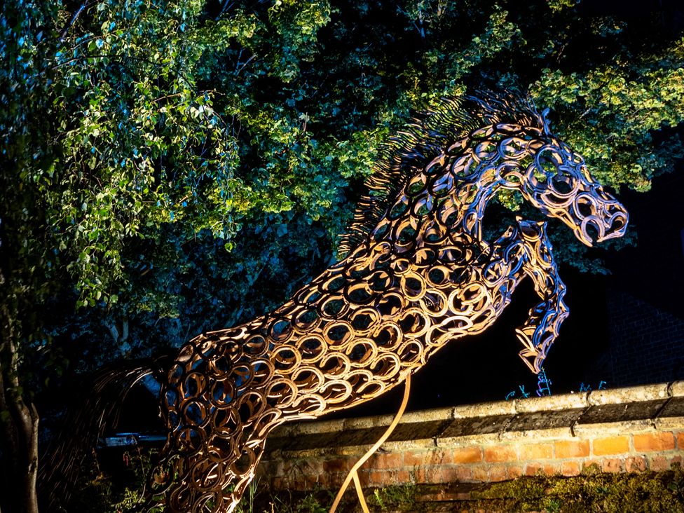 A horse sculpture among trees at Ivy House near Louth