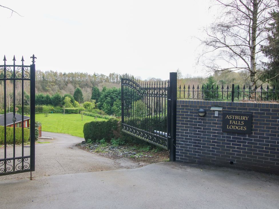 An entrance gate leading to a landscaped area at No.14 Astbury Falls Luxury Retreat in Bridgnorth