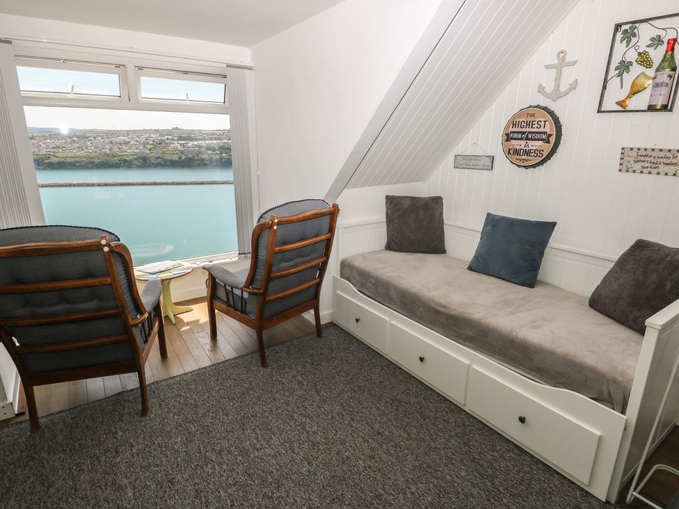 A snug with seating and a view at Seaside Steps in Goodwick