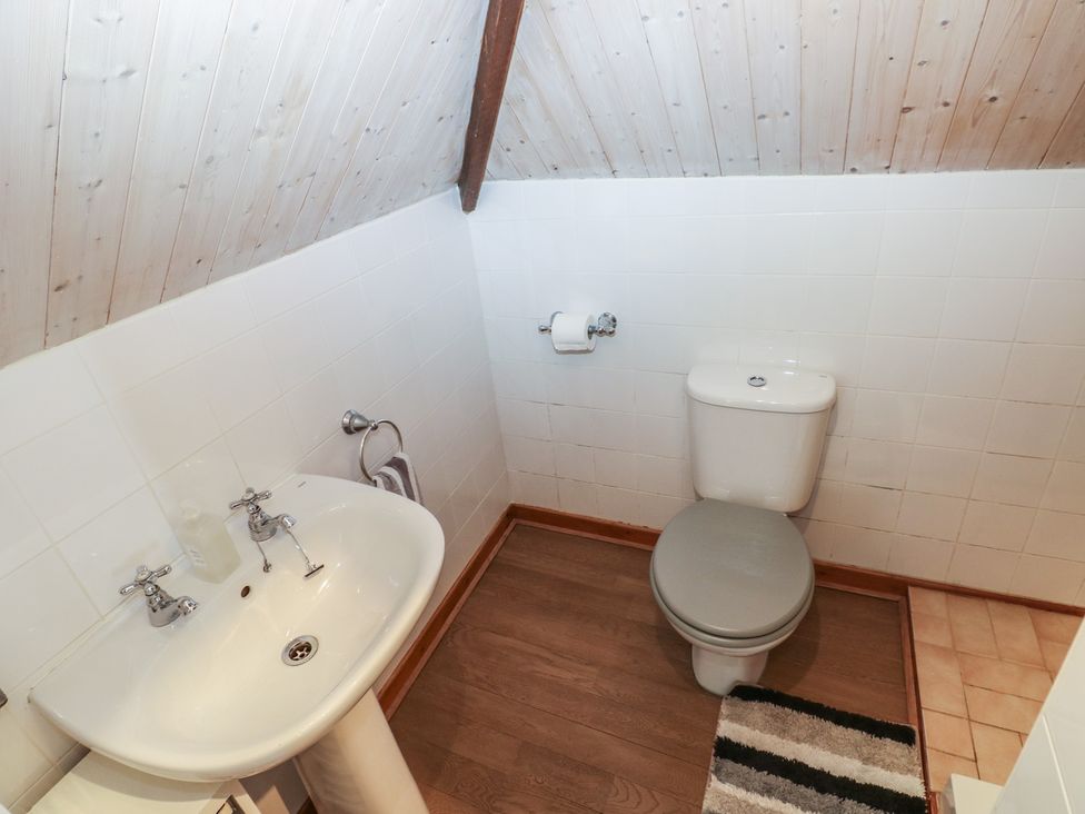 A bathroom with a sink and toilet at Seaside Steps Goodwick