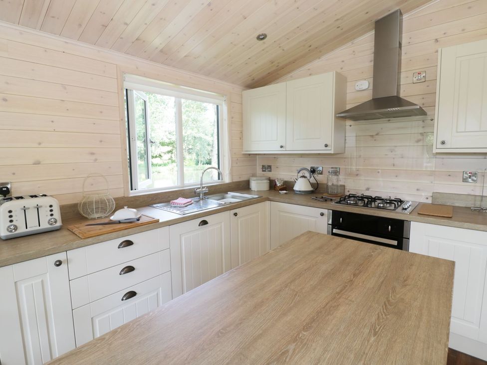 A kitchen with a sink and gas stove at Skylark in Ross-on-Wye
