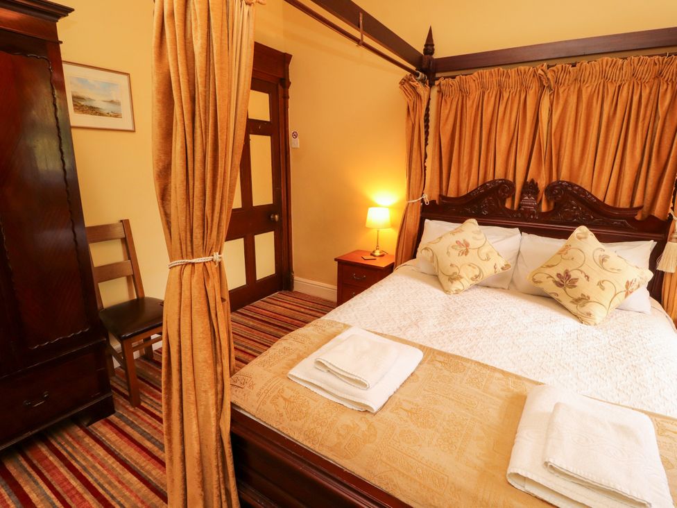A bedroom with a bed and wardrobe at Rochester Apartment in Orton