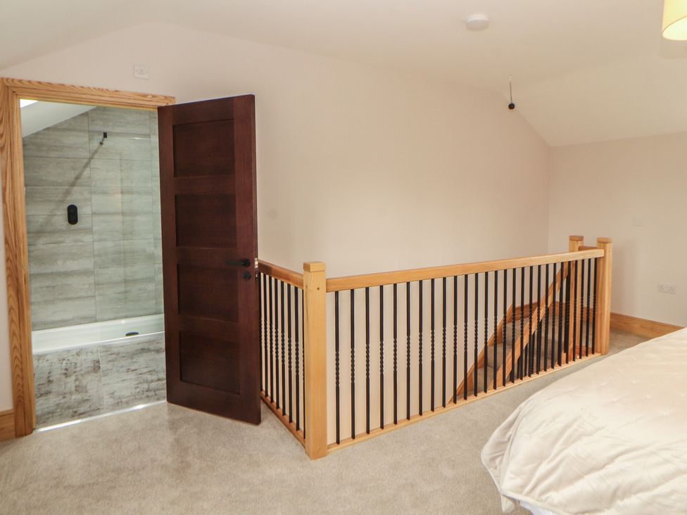 A bathroom with a bathtub and shower at The Gate House Annexe Cockermouth