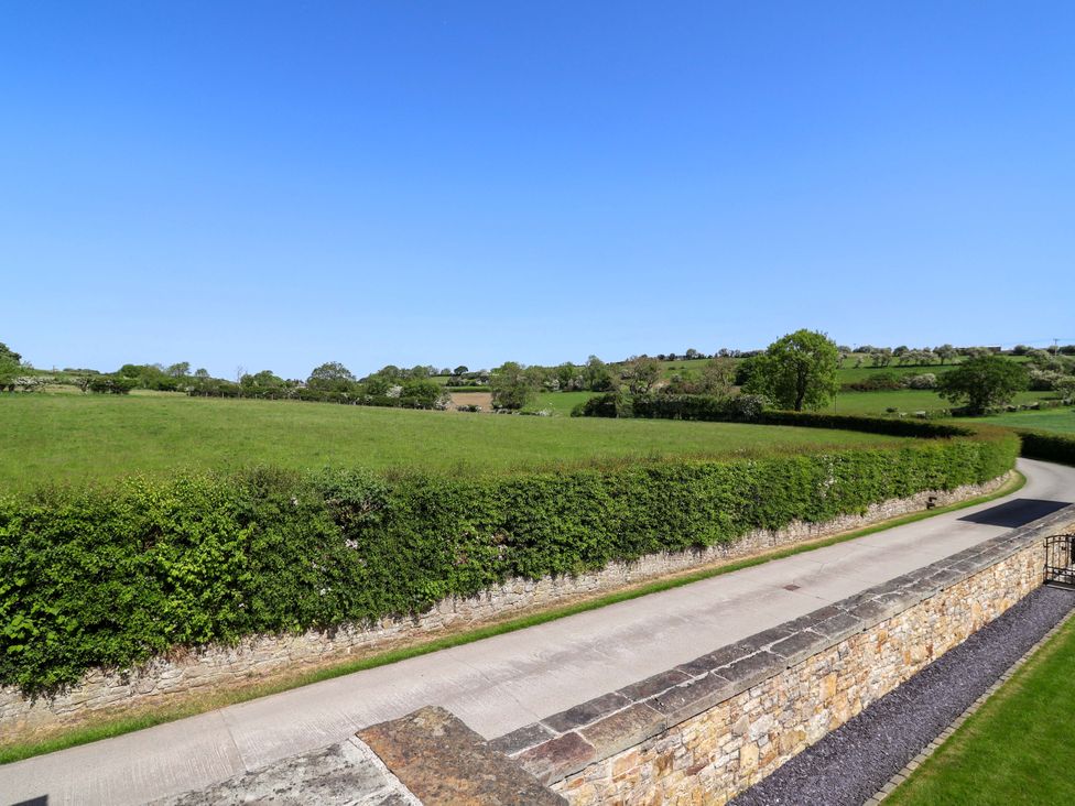 A view of a field and road at Pen Y Grisiau in Mold