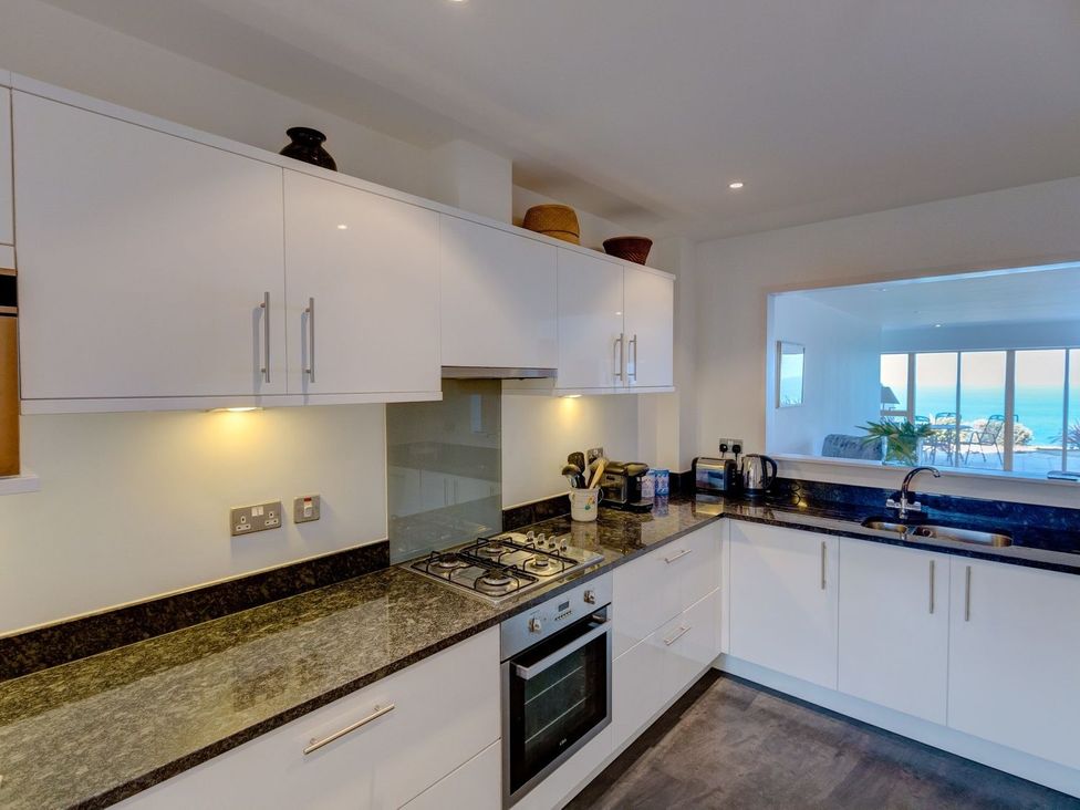 A kitchen with cabinets and appliances at Anchors Rest in St. Ives