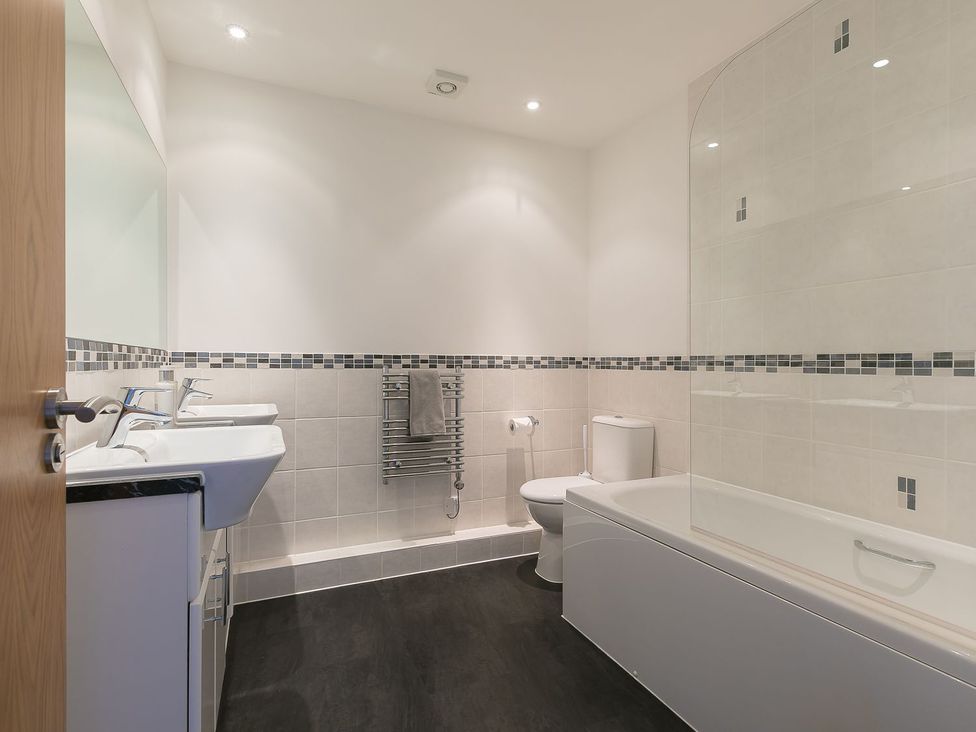 A bathroom with a sink, toilet, and bathtub at Anchors Rest in St. Ives