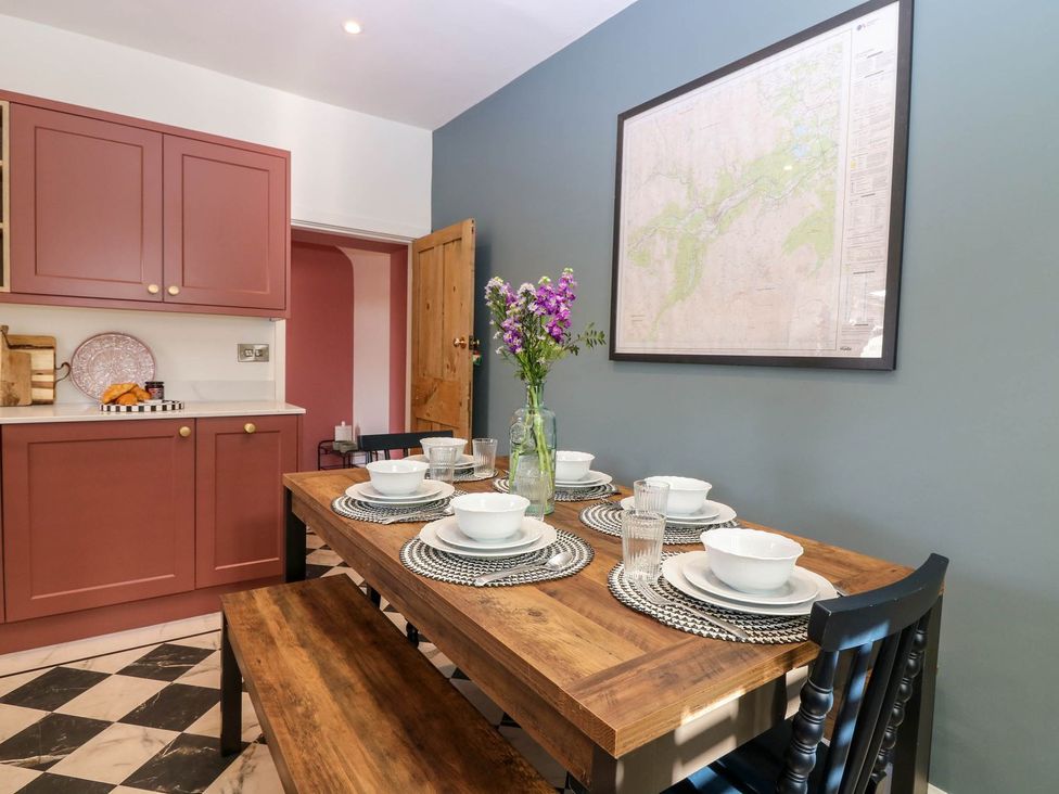 A dining room with a table set for meals at Evansford in Ballater
