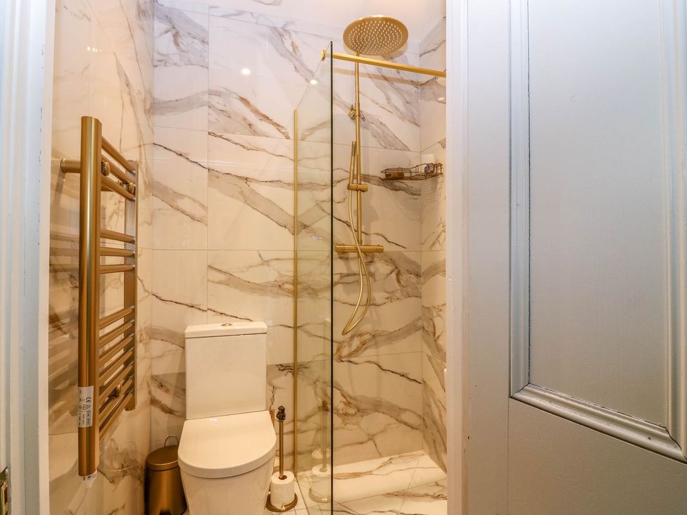 A bathroom with a shower and toilet at Evansford in Ballater