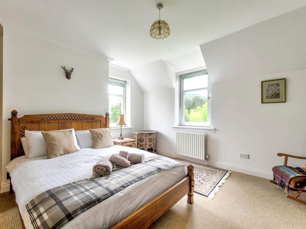 A bedroom with a bed and window at Argyll Farmhouse-Idyllic Setting-Sleeps10 Dunoon