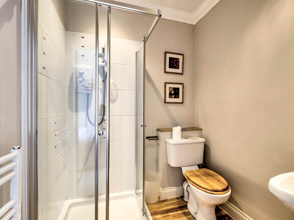 A bathroom with a shower and toilet at Argyll Farmhouse-Idyllic Setting-Sleeps10 in Dunoon