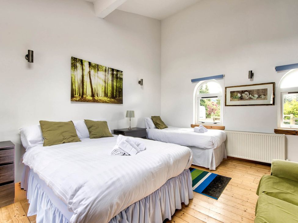 A bedroom with two beds and a painting at Argyll Farmhouse-Idyllic Setting-Sleeps10 in Dunoon