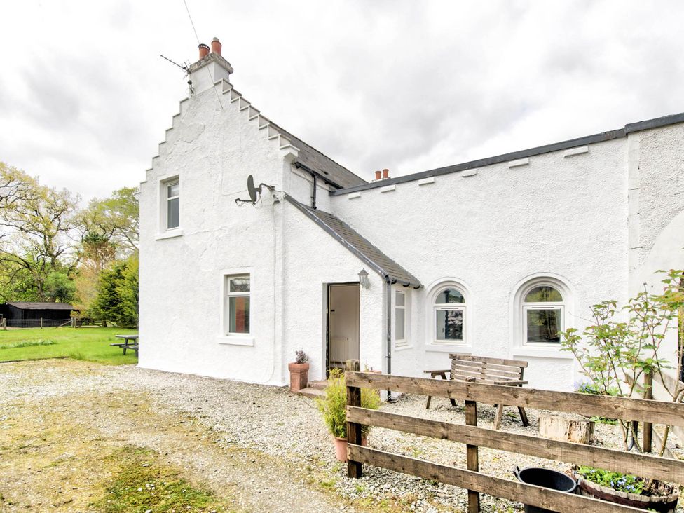 An exterior view of a house with a garden at Argyll Farmhouse-Idyllic Setting-Sleeps10 in Dunoon