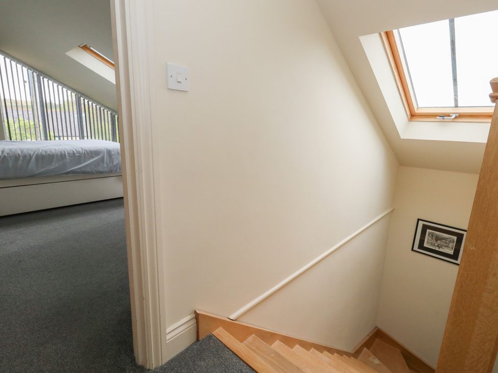 A staircase leading to a bedroom at Millmead House Annex Portesham