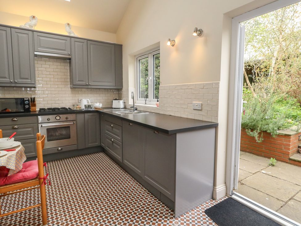 A kitchen with cabinets and countertop at Millmead House Annex in Portesham