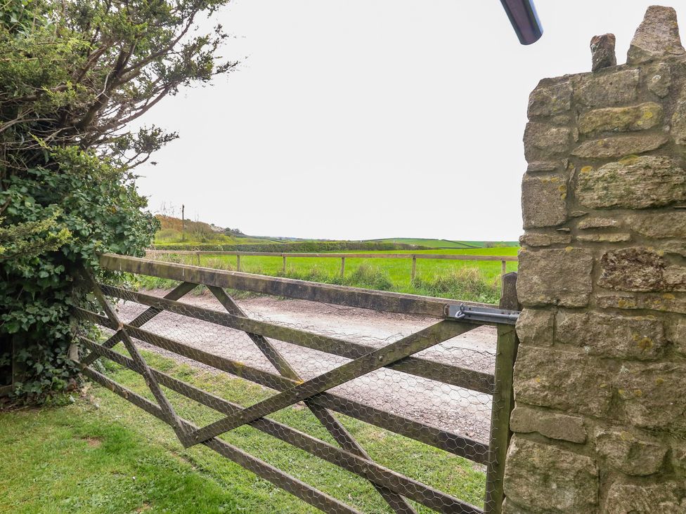 A gate opening to a field at Millmead House Annex Portesham