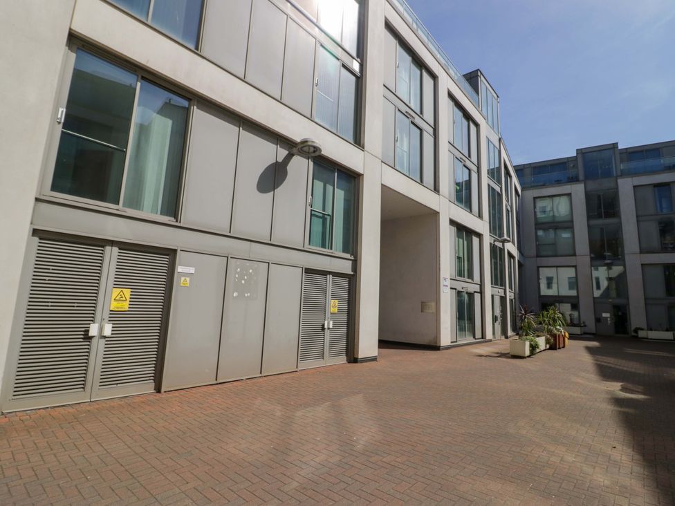 An outdoor area with buildings and plant pots at Apartment 26 in Birmingham