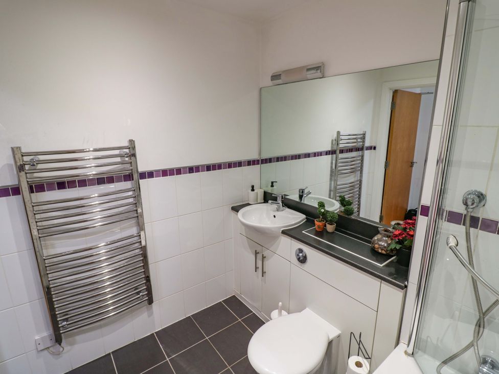 A bathroom with sink and shower at Apartment 26 in Birmingham