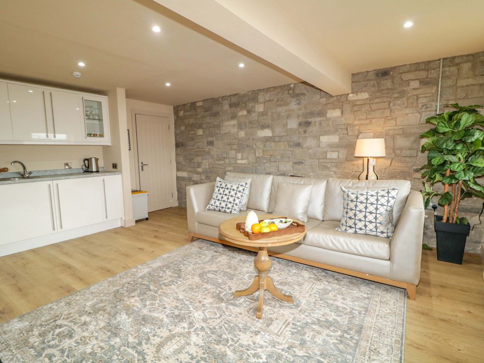 A living room with a sofa and coffee table at Apartment 1 Londonderry