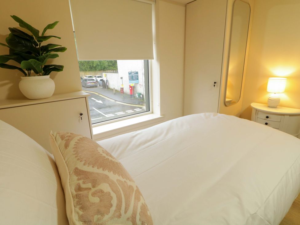 A bedroom with a bed and a window at Apartment 1 Londonderry