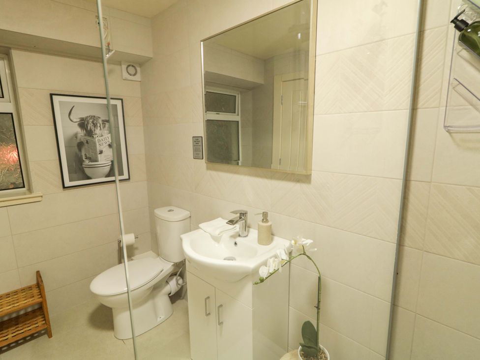 A bathroom with a sink and toilet at Apartment 1 Londonderry